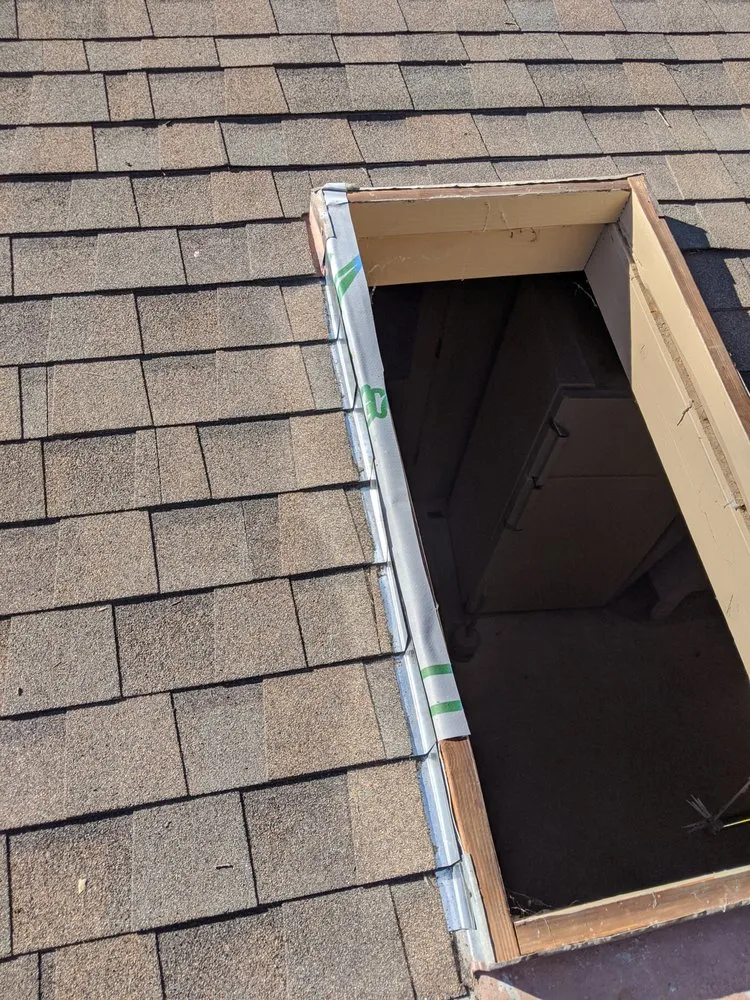 Slide of Tom's Roofing Services