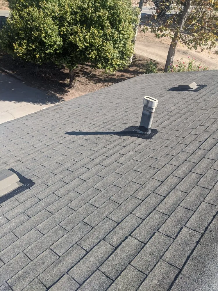 Slide of Tom's Roofing Services