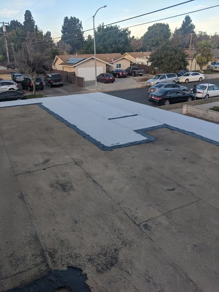 Slide of Tom's Roofing Services