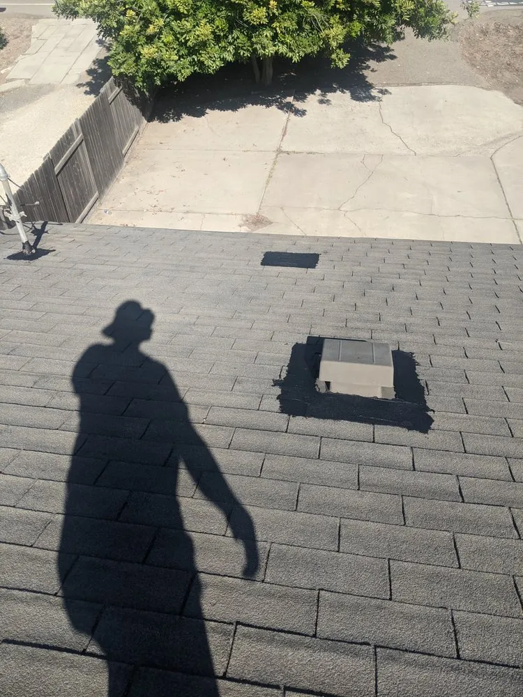 Slide of Tom's Roofing Services