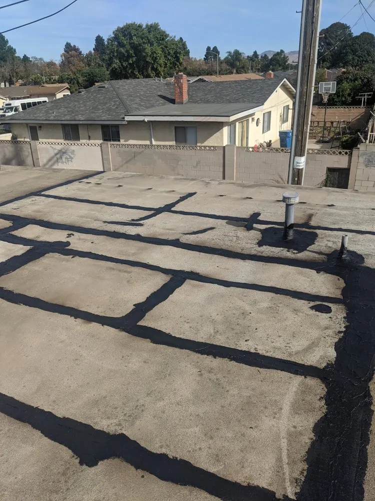 Slide of Tom's Roofing Services