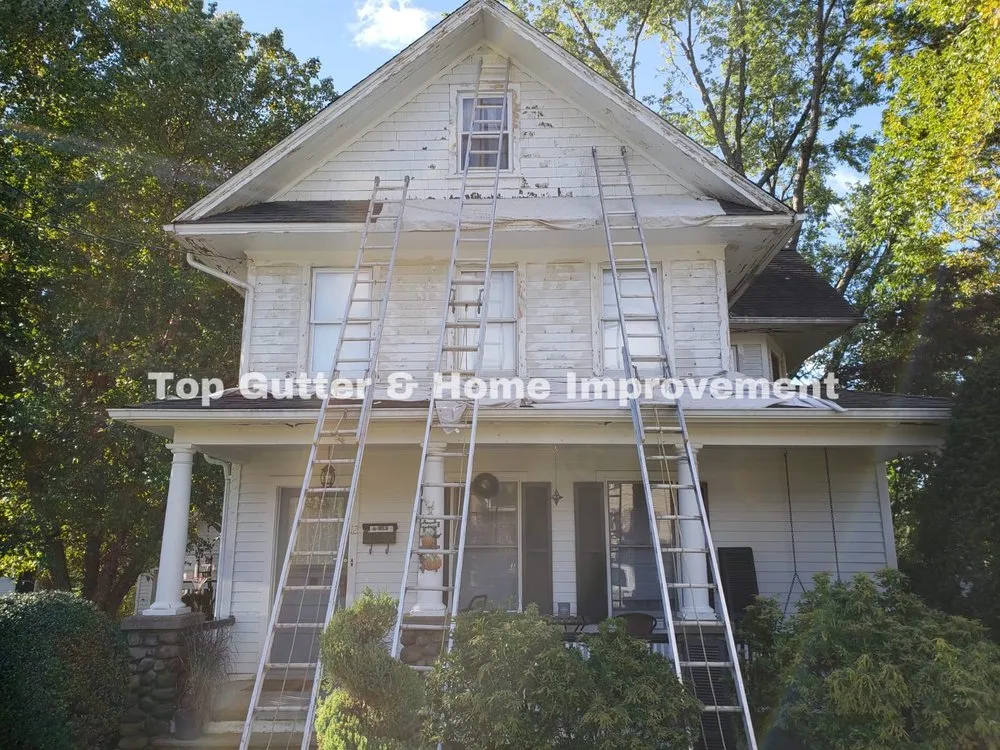 Slide of Top Gutter and Home Improvement Corp