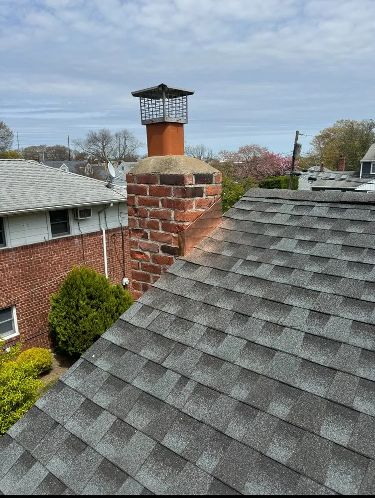 Licensed storm damage roof repair in Long Island, NY by Top Roofing And Chimney