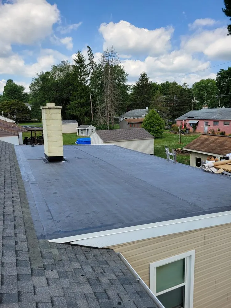 Slide of TopFlight Roofing