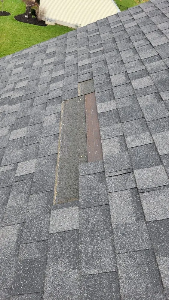 Slide of TopFlight Roofing