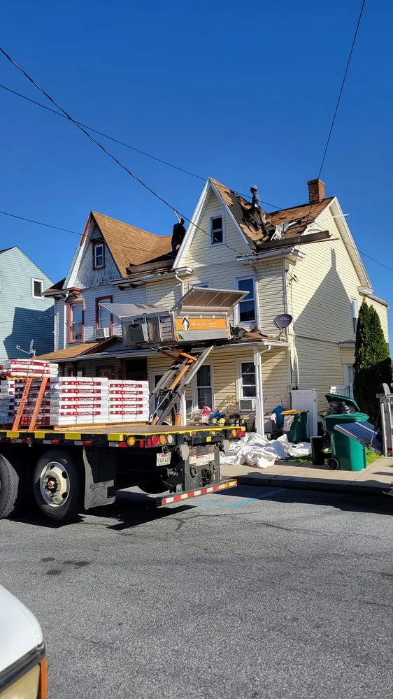 Slide of TopFlight Roofing