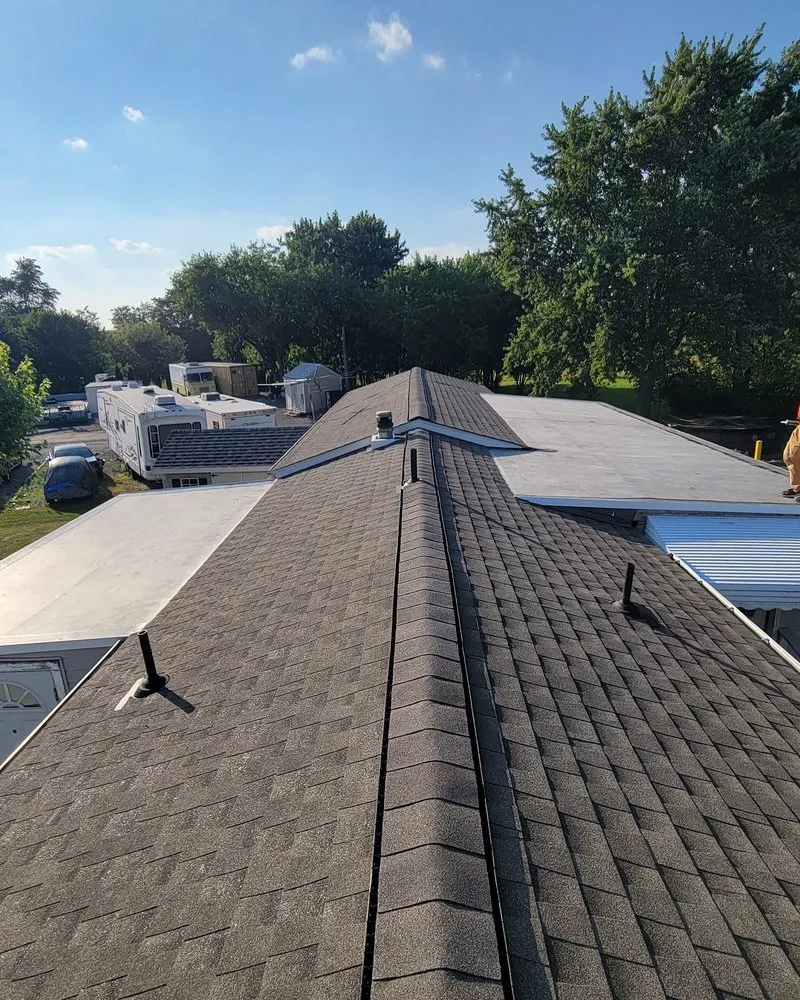 Slide of TopFlight Roofing