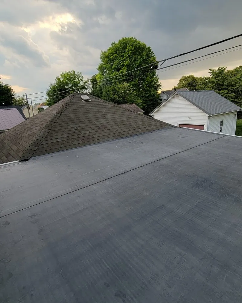 Slide of TopFlight Roofing