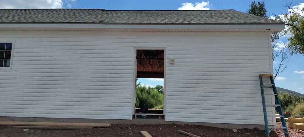 Licensed shingle roofing service in Berkeley Springs, WV by TP Roofing Gutters & Siding