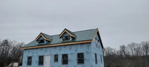 TP Roofing Gutters & Siding Logo