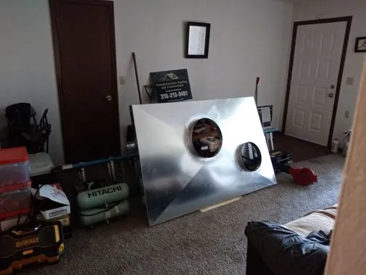 Transformation Roofing & Construction Logo