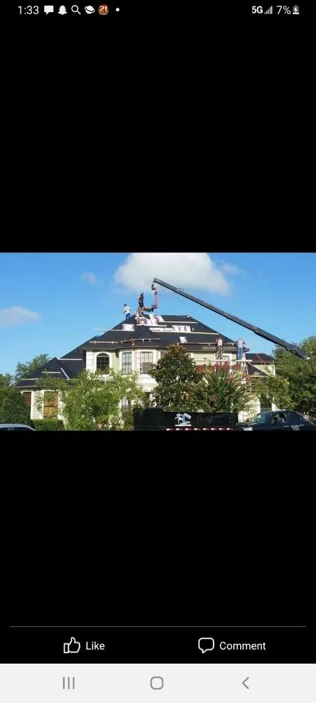 Slide of Travie T's Roofing Firm