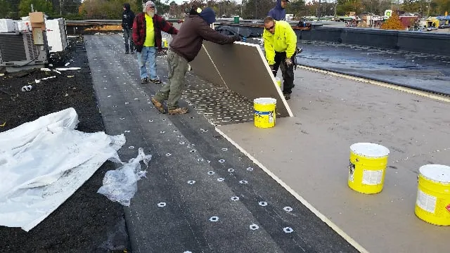 Professional flat roof repair after storm damage in Kimball, MI by Tri-Star Roofing & Sheet Metal