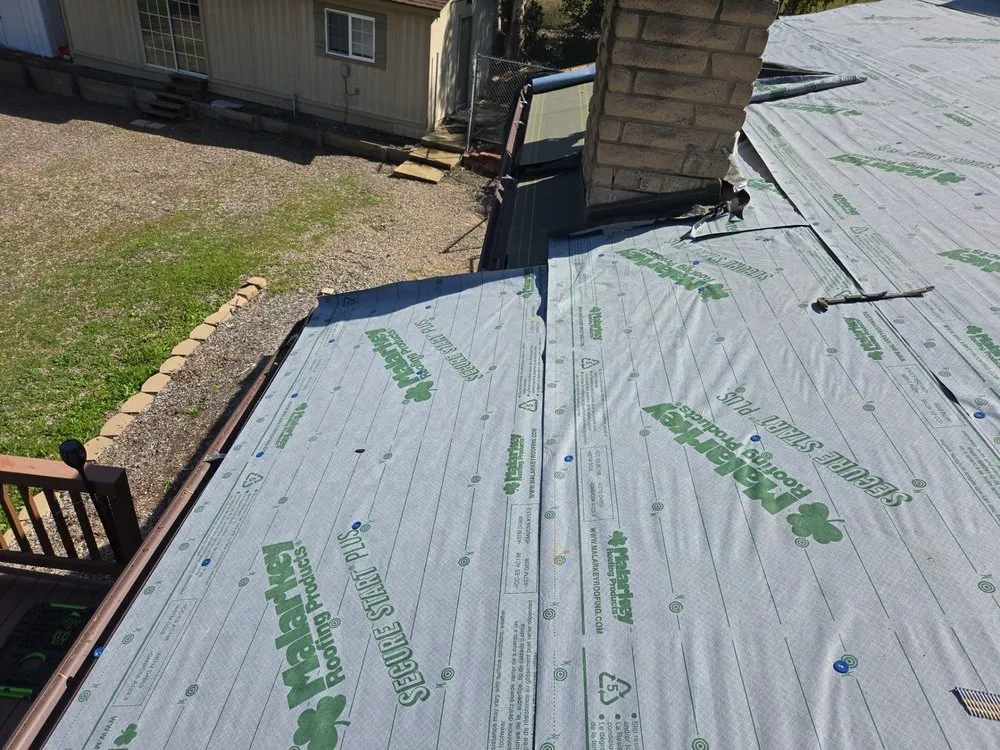 Slide of Triark Roofing