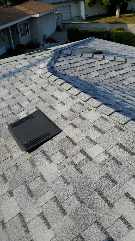 Slide of Trinity Roofing L & R Brothers