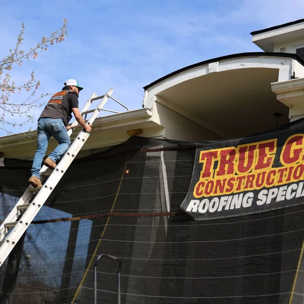 Slide of True Grit Roofing Company
