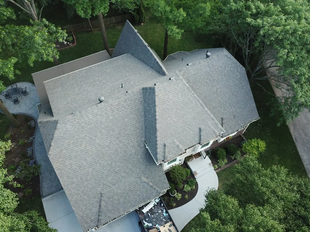 Slide of True Grit Roofing Company