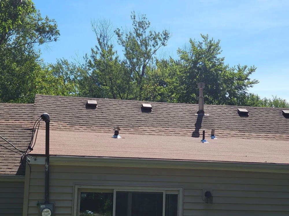 Slide of True Grit Roofing Company