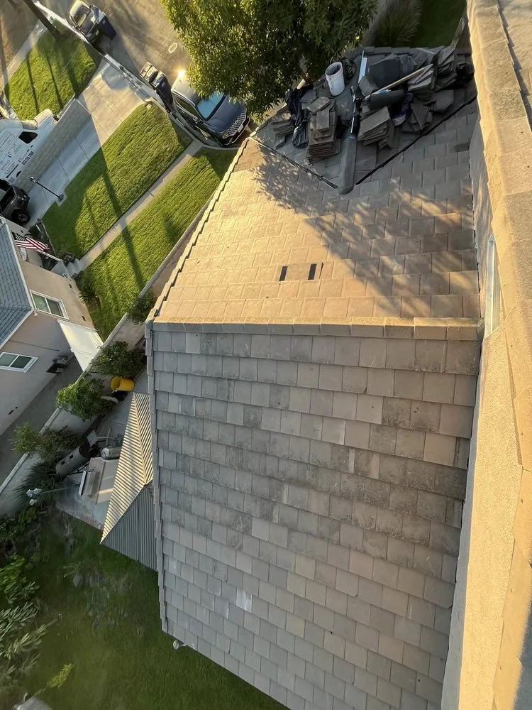 Slide of T’s Roofing 