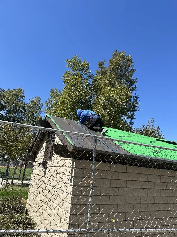 Slide of T’s Roofing 