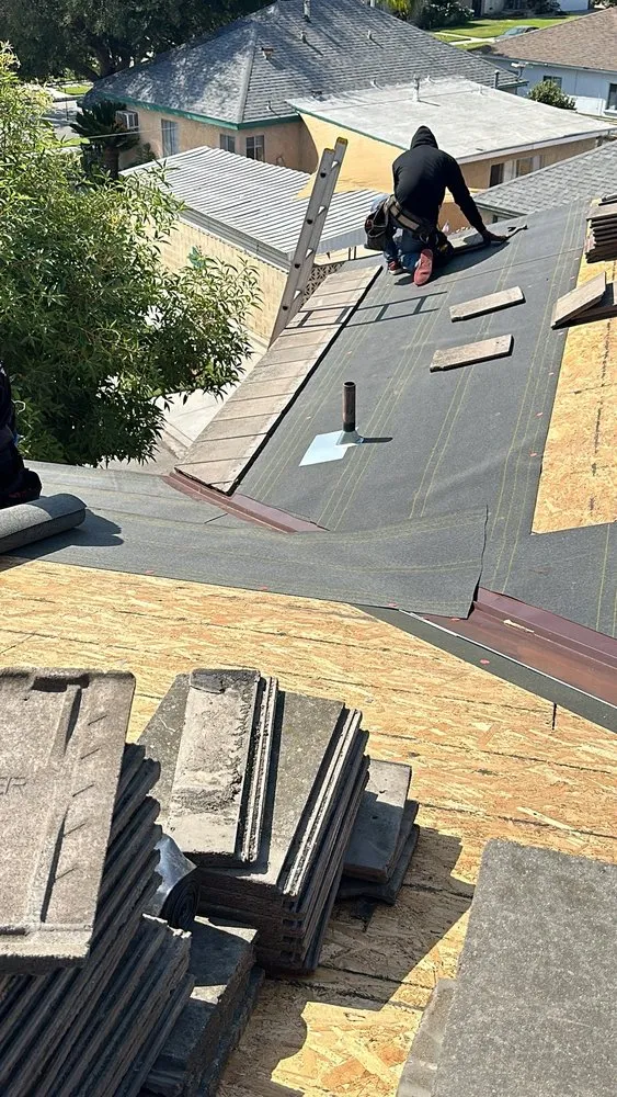 Slide of T’s Roofing 