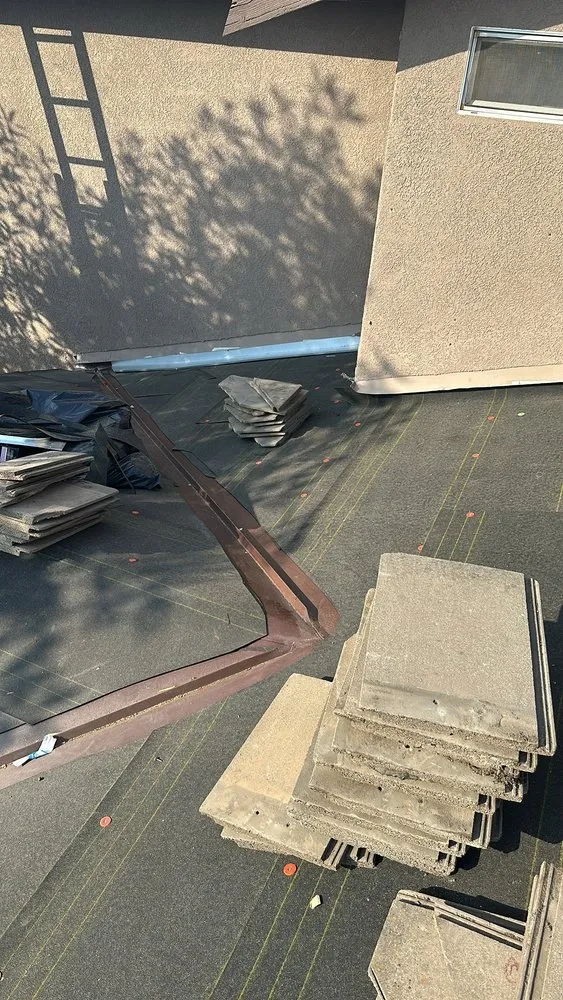 Slide of T’s Roofing 