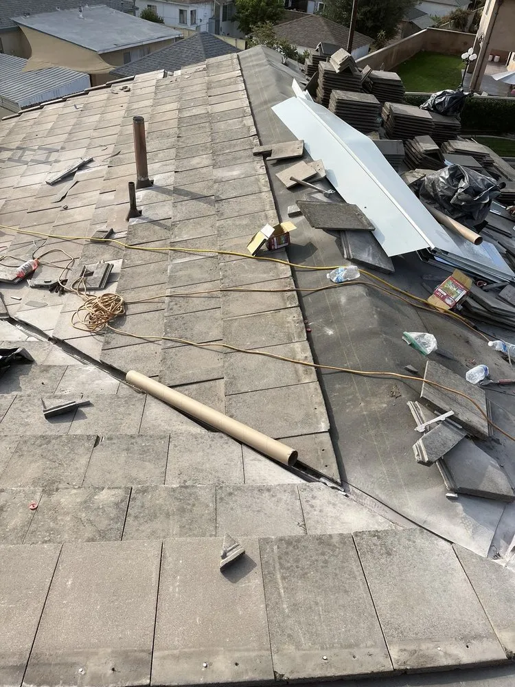 Slide of T’s Roofing 