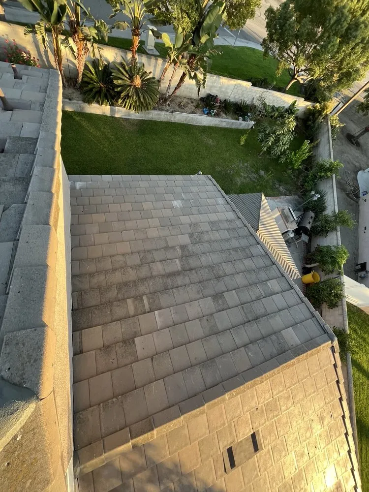 Slide of T’s Roofing 