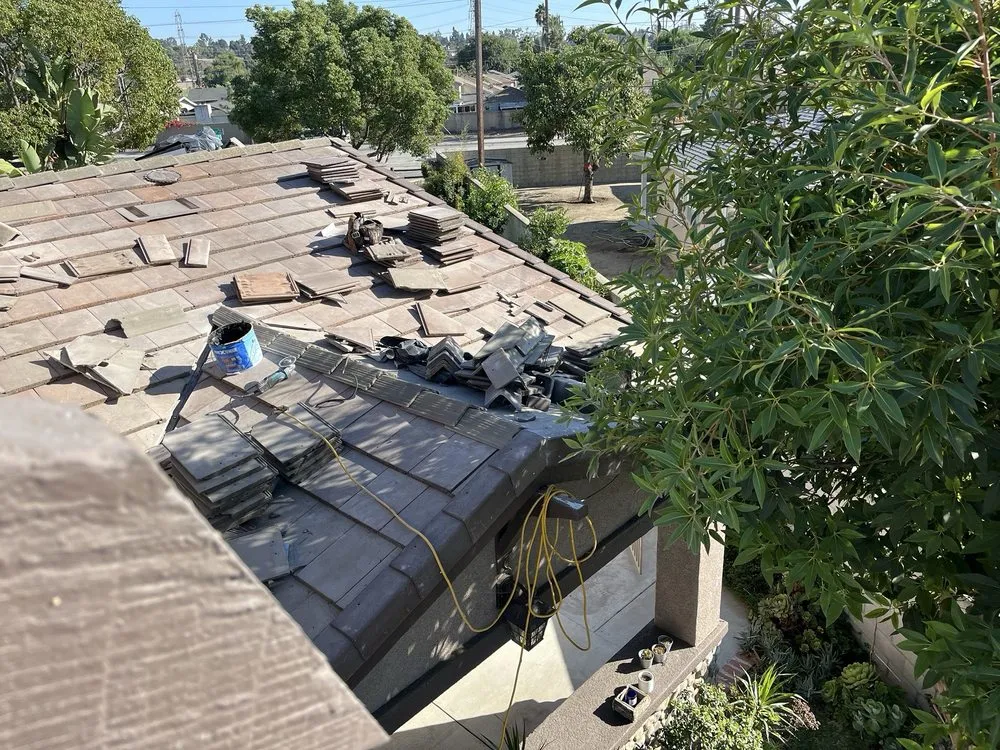 Slide of T’s Roofing 