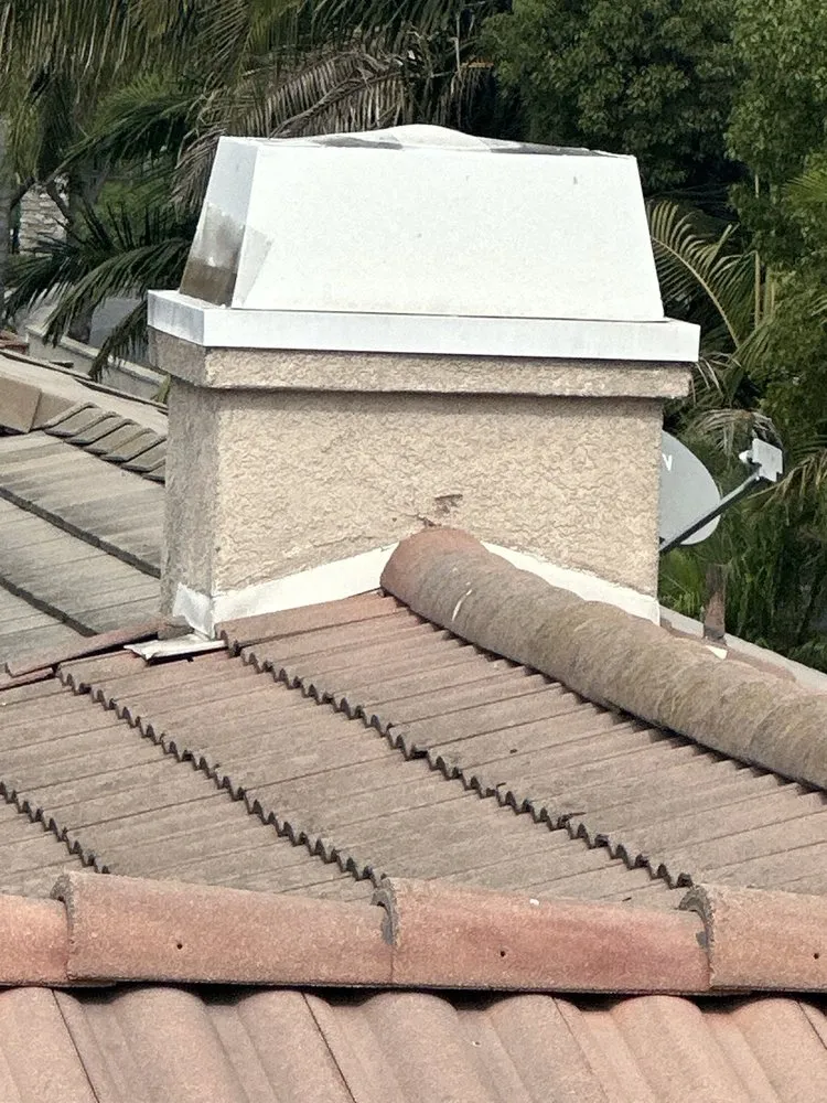 Slide of T’s Roofing 