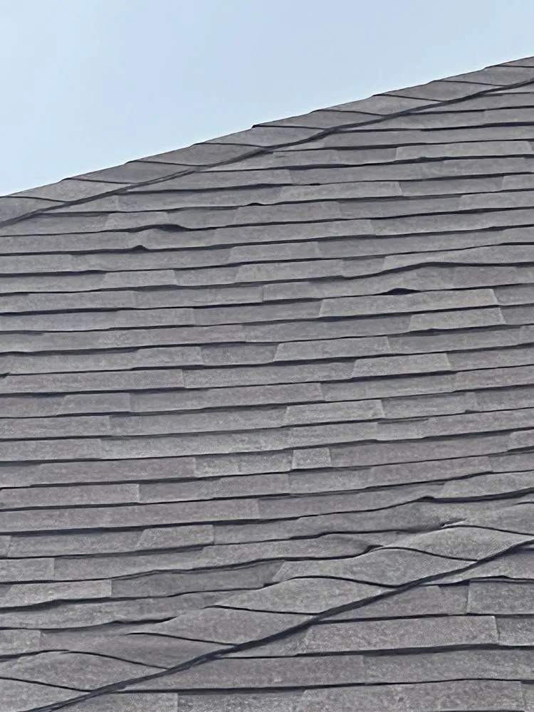 Slide of Tucker Roofing Systems