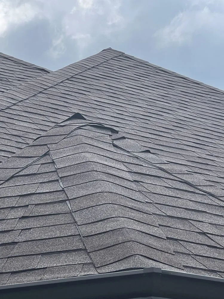 Slide of Tucker Roofing Systems