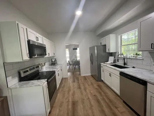 Turn 2 Remodeling & Roofing Logo