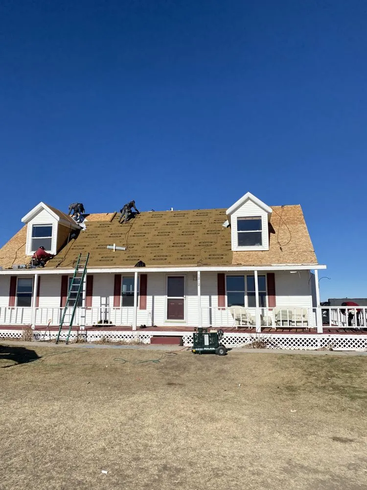 Slide of Twin Mountain Roofing