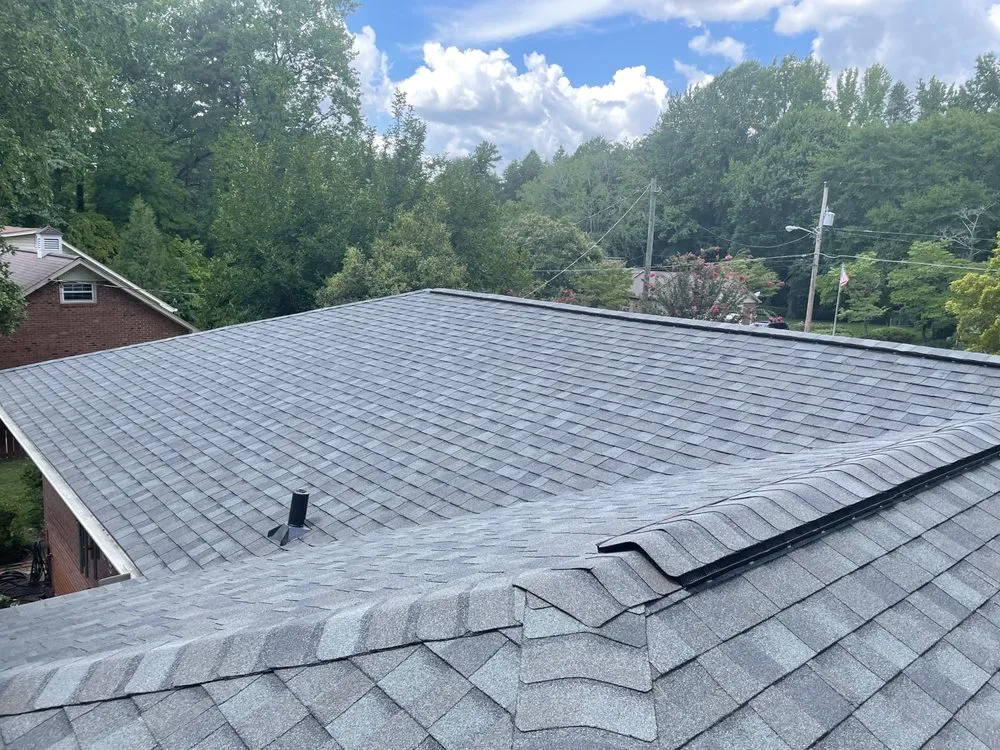 Slide of Twins Roofing Solutions