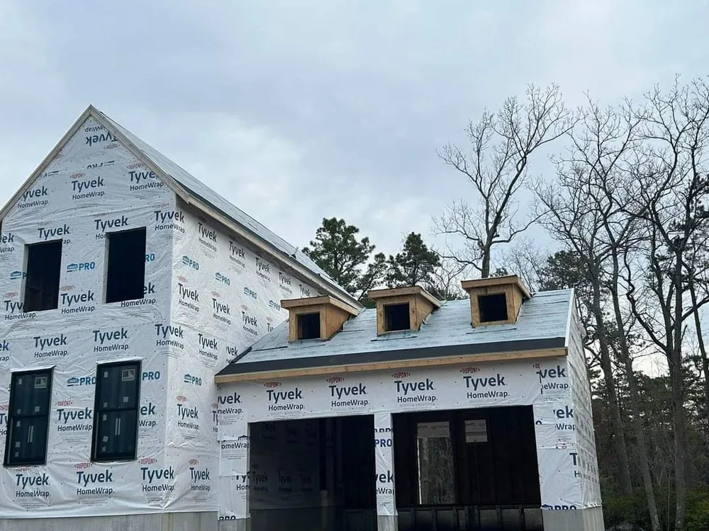 Slide of TWO and a half MEN Construction