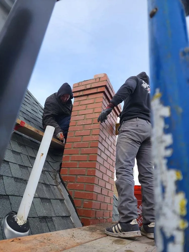 Slide of Two Brothers Roof & Chimney