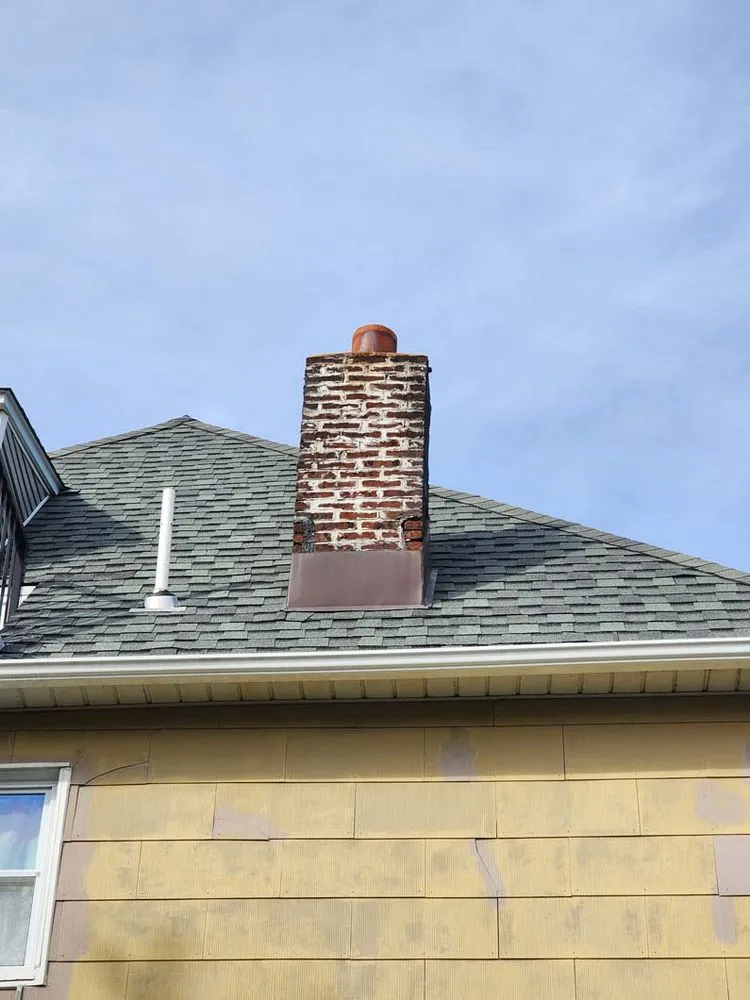 Slide of Two Brothers Roof & Chimney