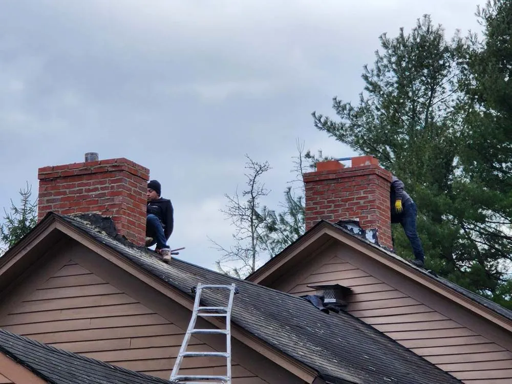 Slide of Two Brothers Roof & Chimney