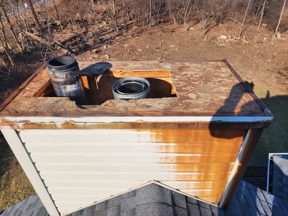 Slide of Two Brothers Roof & Chimney