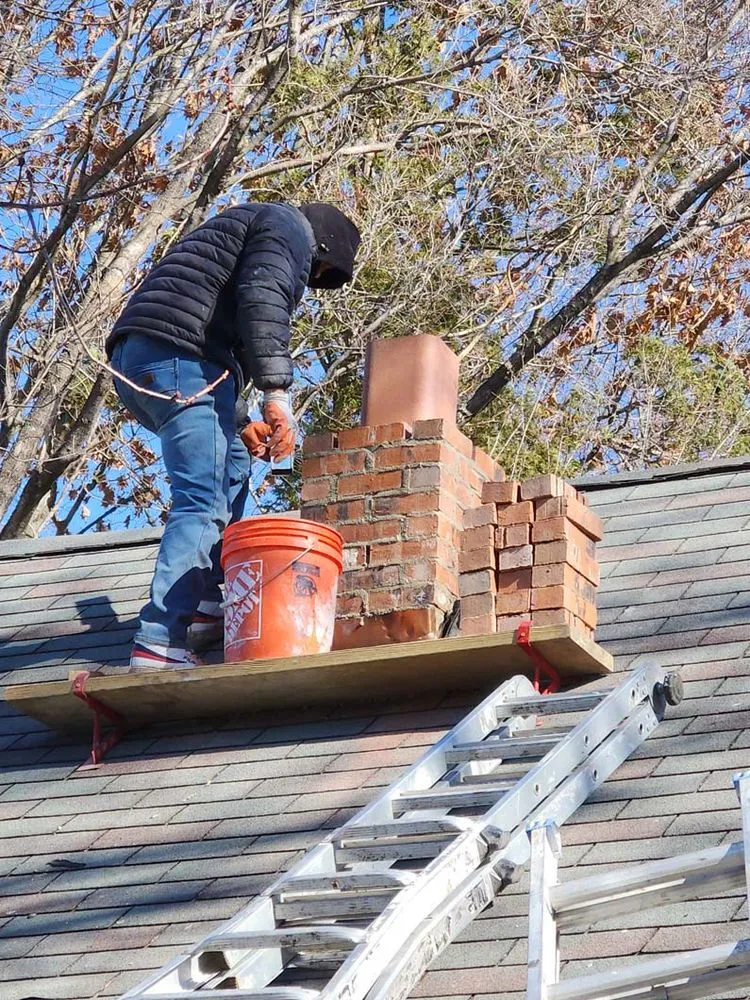 Slide of Two Brothers Roof & Chimney
