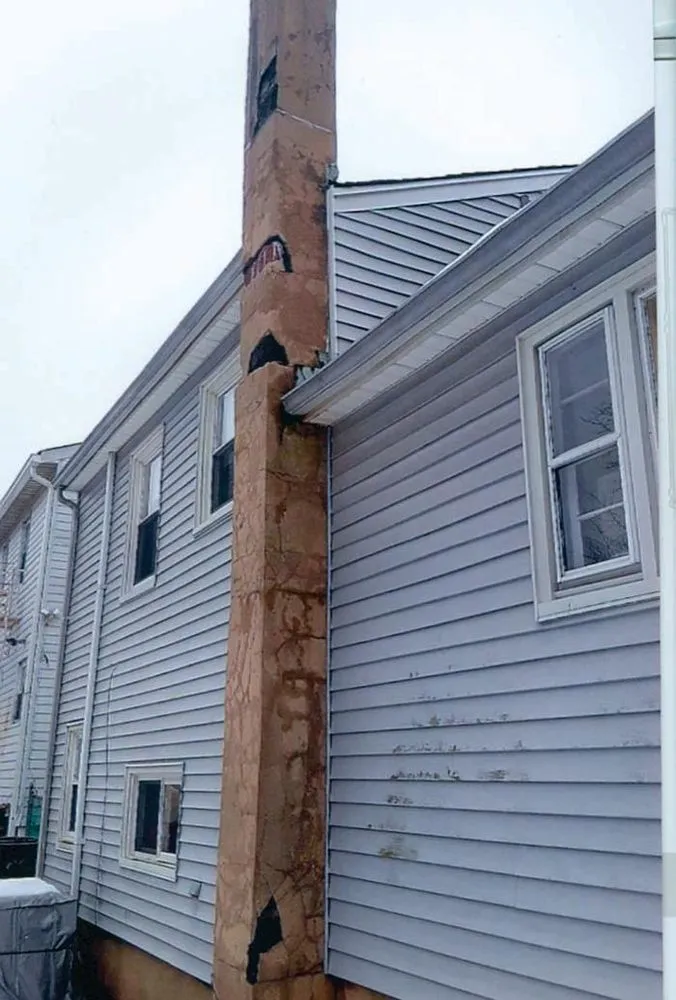 Slide of Two Brothers Roof & Chimney
