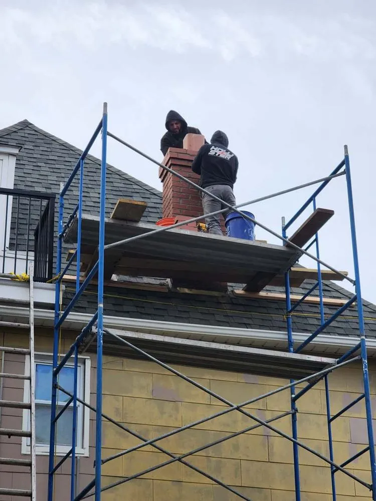 Slide of Two Brothers Roof & Chimney