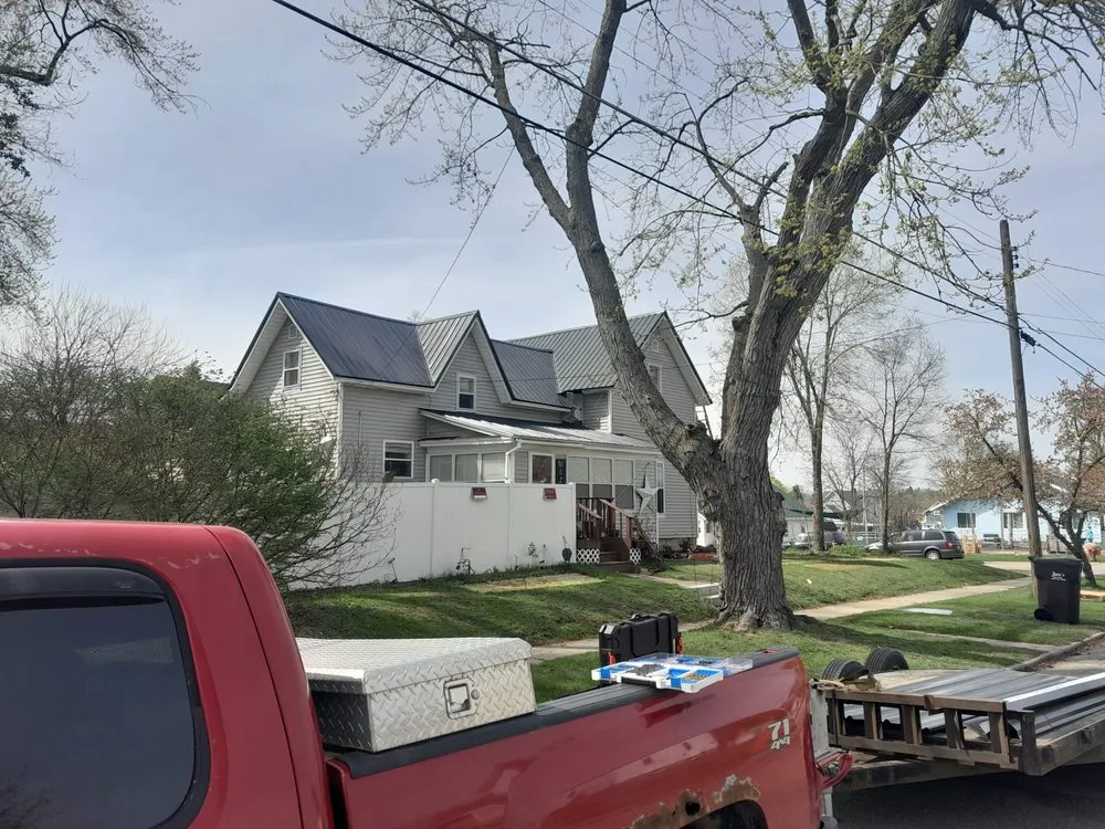 Slide of Tyler fox metal roofing company
