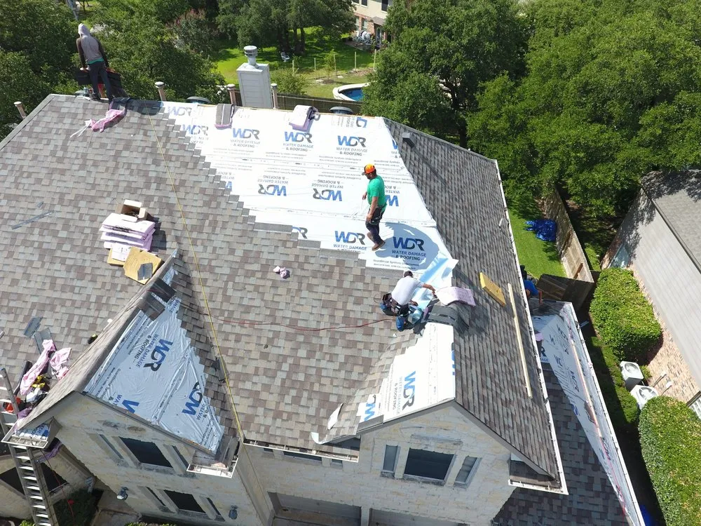 Slide of Ultimate Roofing Company