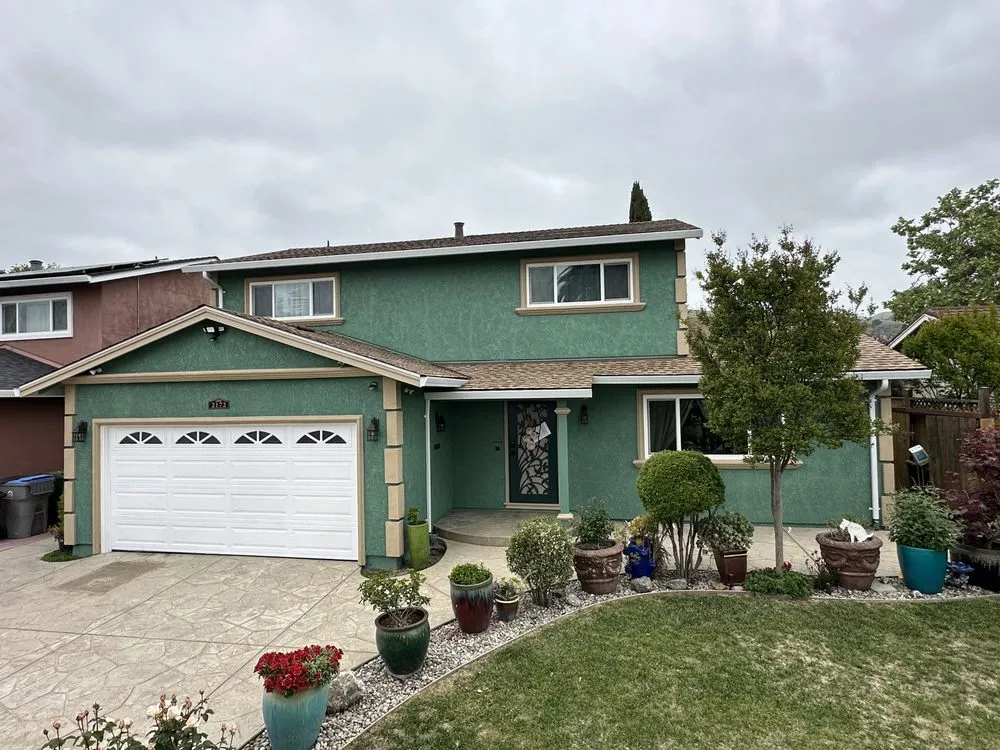 Slide of Umbrella Plastering & Roofing