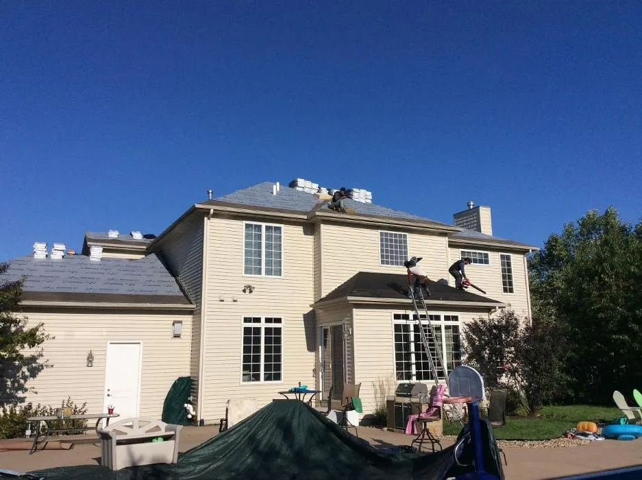 Reliable shingle roofing service after storm damage in Princeton, IA by United American Contracting