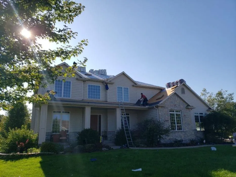 Licensed shingle roofing service in Princeton, IA by United American Contracting