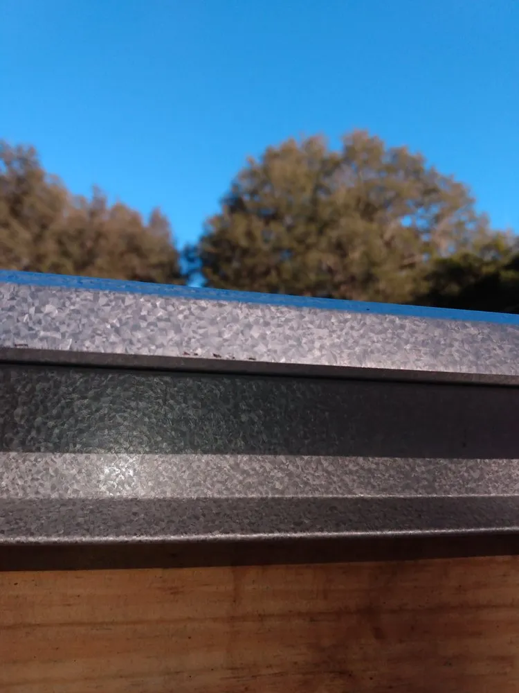 Slide of UnZucky Roofing