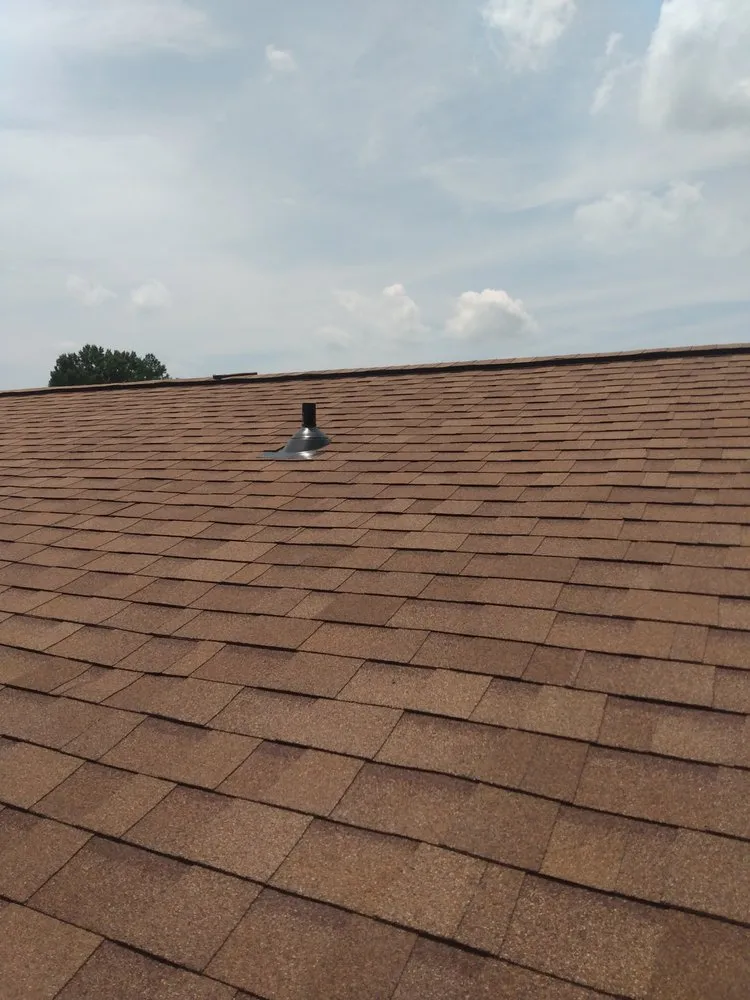 Slide of UnZucky Roofing